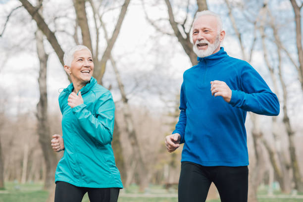 istock Fit old couple jogging together 960016120