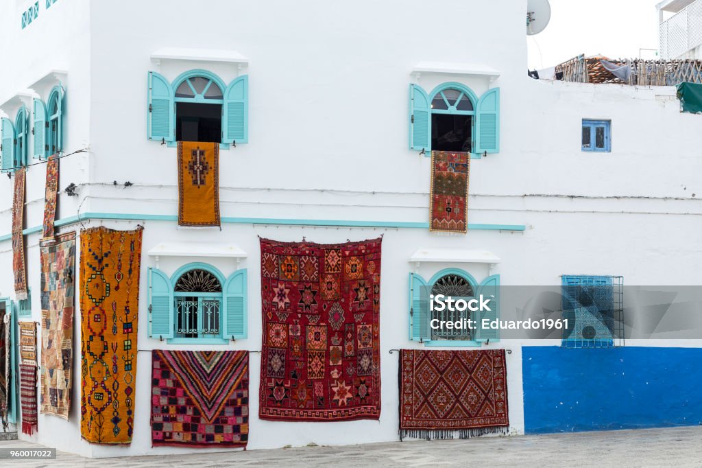 Typical arabic architecture in Asilah. Typical arabic architecture in Asilah. Streets, doors, windows, shops.Morocco Tangier Stock Photo