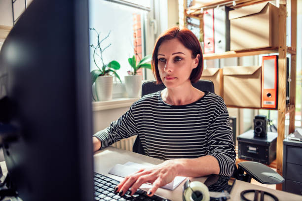 istock Business woman working on computer at the office 960018082