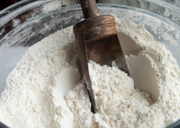 istock Flour with Wood Copper Scoop in Glass Container 960020620