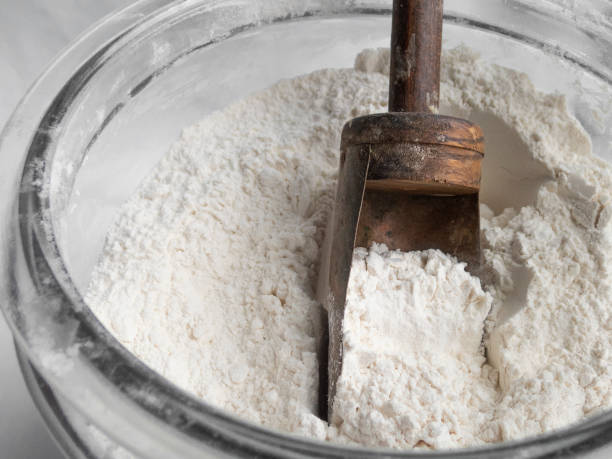 istock Flour with Wood Handled Copper Scoop in Glass Container 960020912
