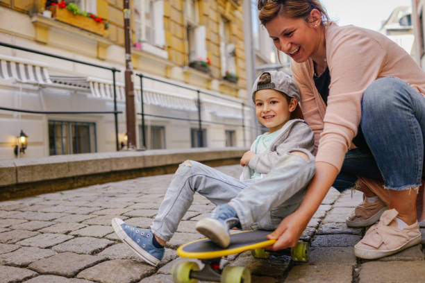 istock Little skateboarder and his mom 960021392