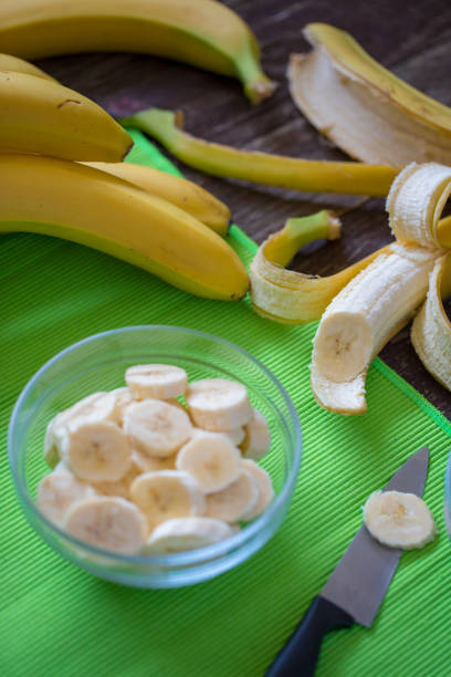 istock healthy life - cutting sliced fresh banana for breakfast 960023966