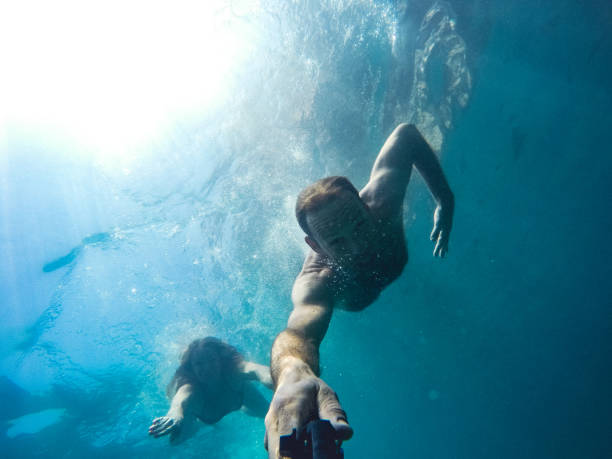 istock Adult Couple Taking a Selfie Underwater 960024206