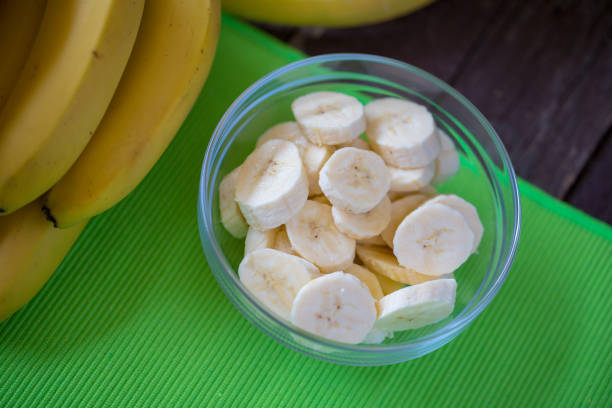istock healthy life - cutting sliced fresh banana for breakfast 960027206