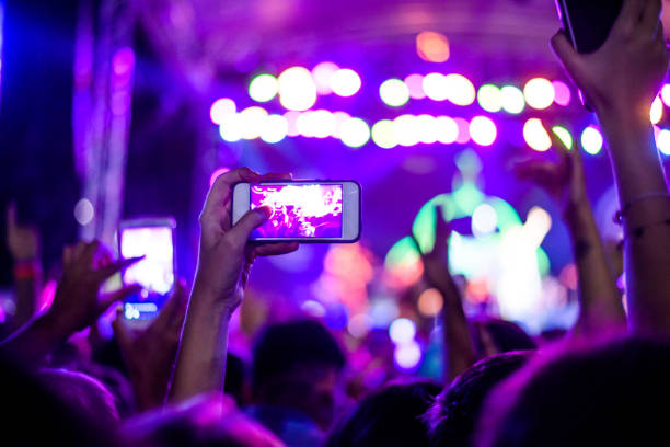 istock People filming a concert 960038248