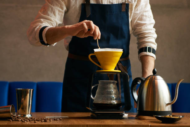 istock Professional Barista or coffee barman prepares coffee 960039088