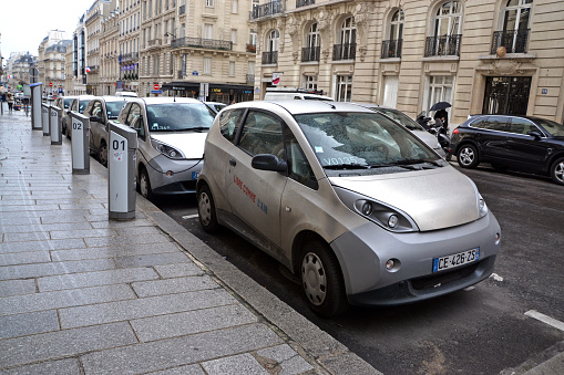 Paris, France - 5th, February 2014: Zero emission Bluecar vehicles parked on the street. Bolloré Bluecar is a small four-seat, three-door electric car supplied by Bolloré, designed by Pininfarina and manufactured by Cecomp in Bairo, Italy.