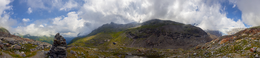 Panoramic view to the Innerer Knorrkogel in Tyrol, at the Innergschloess Glacier Trail, with a stack of stones.