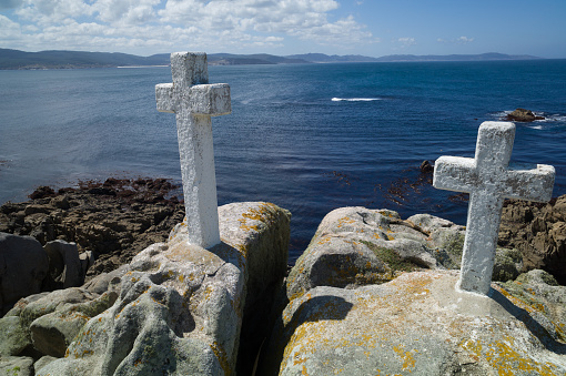 Death Coast with lighthouse and cross of dead fishermen in Galicia