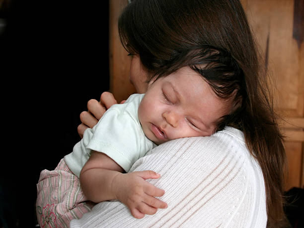 istock Newborn Baby Fast Asleep on Mom with hug 96004969