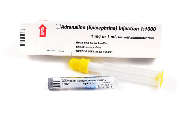 Emergency Adrenaline Epinephrine Injection 2 Emergency Adrenaline Epinephrine Injection isolated on white adrenaline stock pictures, royalty-free photos & images