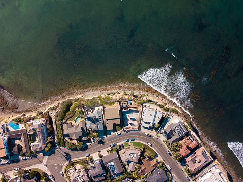 Aerial view of the turquoise sea and beach houses in California