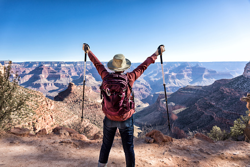 mature female hiker enjoying the view on the soutern rim of the Grand Canyon