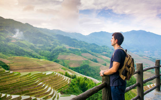 istock Man enjoying stunning Asian rice terrace scenery 960053946