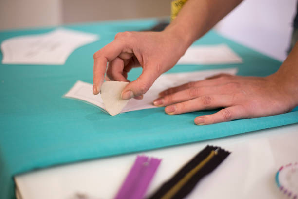 istock Seamstress woman preparing material 960054550