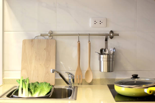istock kitchen cabinet with sink and electric stove 960062188