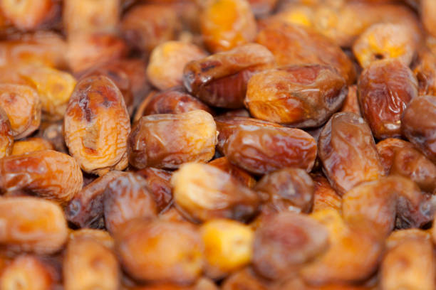 istock Dried dates Fruit.  fresh dates fruits background. close up dates fruits 960065994
