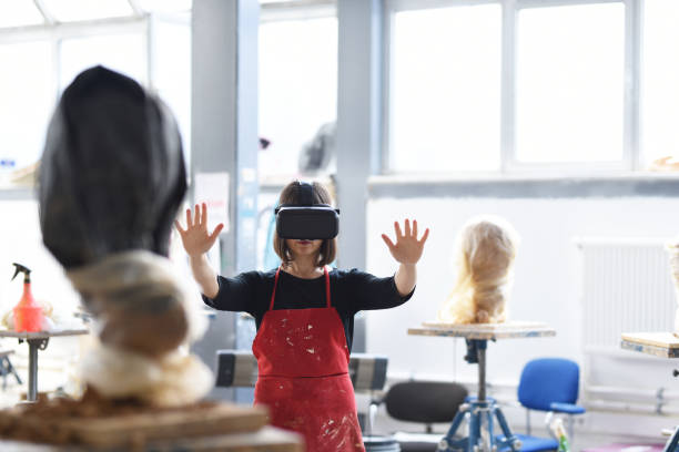 istock Young Female Sculptor is working with VR in her studio 960068764