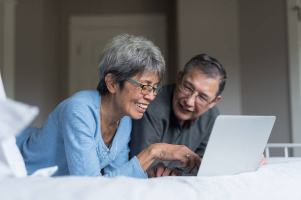 istock Senior couple planning their vacation online 960068772