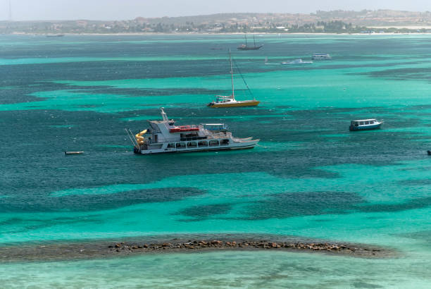 View of boat on a contrast color water in Aruba Island stock photo