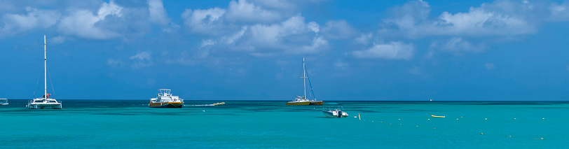 Panoramic picture to the tropical beach of the Caribbean sea in Aruba Island.