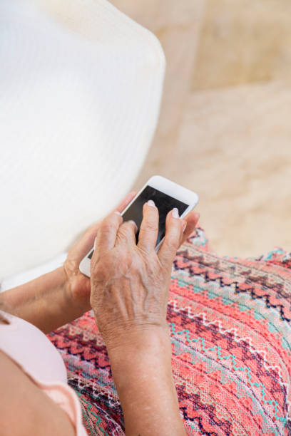 istock Beauty senior using phone at hotel 960077518