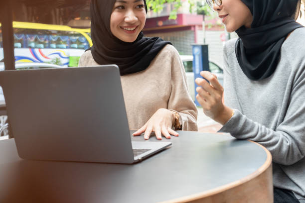 istock Girls wearing hijab working on project. 960078300