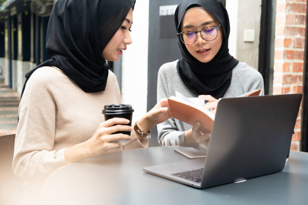 istock Girls wearing hijab working on project. 960078330