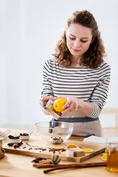 istock Woman rubbing orange skin 960079068