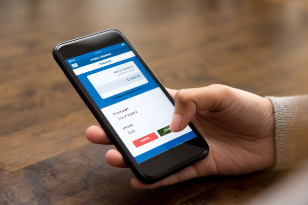 istock Woman hand touching confirm button on smartphone screen, transferring money online 960079518