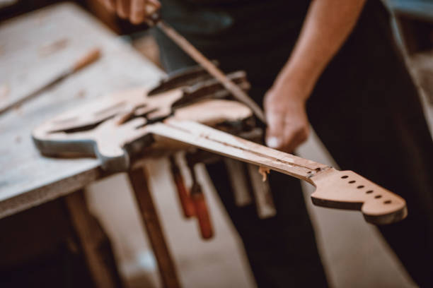 Guitar Manufacturer Polishing His New Masterpiece