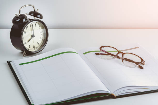 istock business reminder concept with Appointment book, alarm clock, glasses 960102848