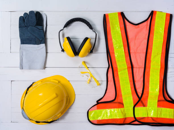 istock Standard construction safety equipment on wooden table. top view 960111410