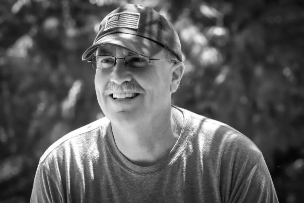 istock Smiling senior male in black and white 960120470