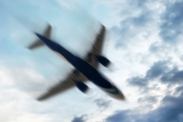 Airplane with problems : Concept - Blurred motion. aerophobias concept. plane shakes during turbulence flying air hole. Blur image commercial plane moving fast downwards. Fear of flying. collapse slump, depression, downfall, debacle, subsidence, trip. airplane crash photos stock pictures, royalty-free photos & images