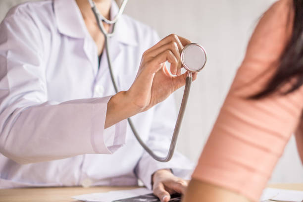 istock doctor hand examining patient with stethoscope at a hospital 960126318