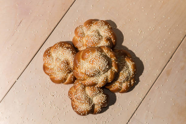 istock Buns with sesame seeds on a wooden background 960126626