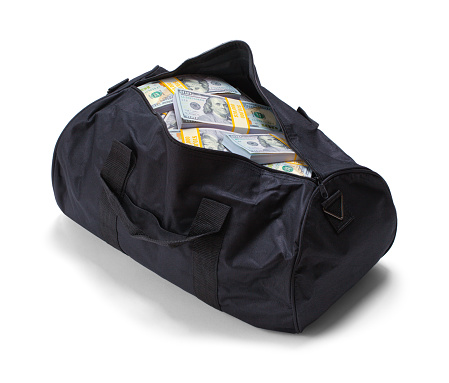 Full Black Duffel Bag of Hundred Dollar Bills Isolated on a White Background.