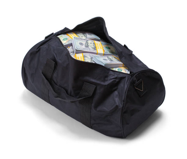 duffel bag full of money - gym bag imagens e fotografias de stock