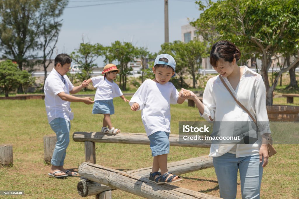 Family enjoying holidays in the park Twin family portrait Holiday in Okinawa 30-39 Years Stock Photo