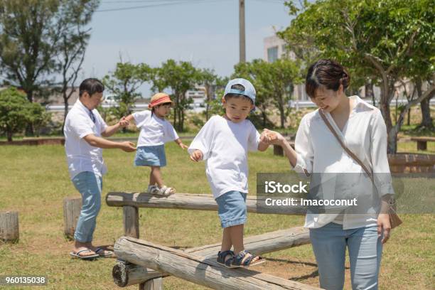 Family Enjoying Holidays In The Park Stock Photo - Download Image Now - 30-39 Years, Adult, Bonding