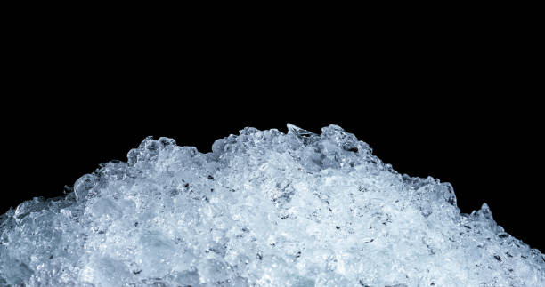istock Pile of crushed ice cubes on dark background with copy space. Crushed ice cubes foreground for beverages. 960145544