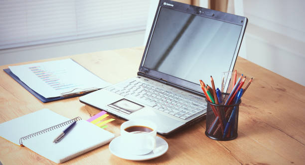 istock Workplace with notebook laptop Comfortable work table in office windows and city view 960149080