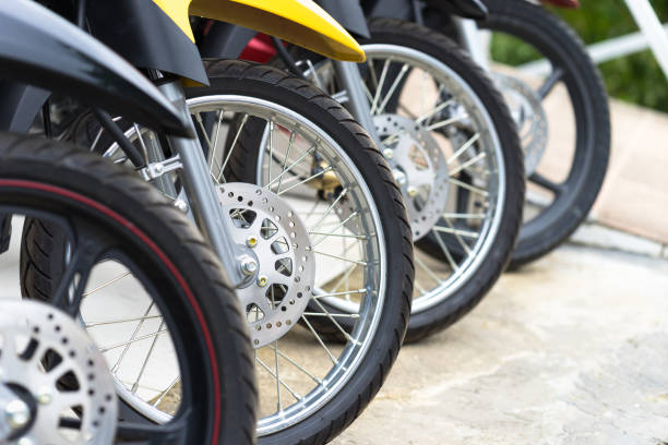 istock Motorcycles standing in the row at a store, closeup 960150544