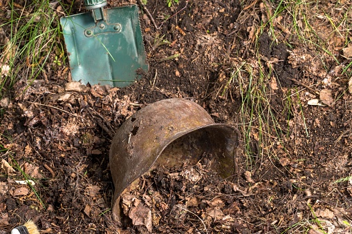 Excavations in the forest. The German helmet. Imitation. WW2 recovery. Russia.