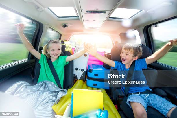 Children Relax In The Car During A Long Car Journey Stock Photo - Download Image Now