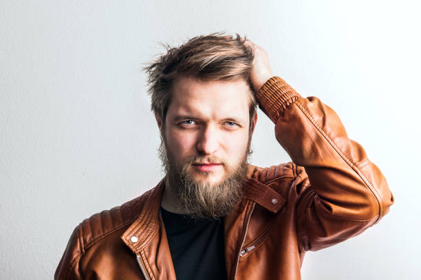 istock Portrait of a young hipster man in a studio. Copy space. 960159712