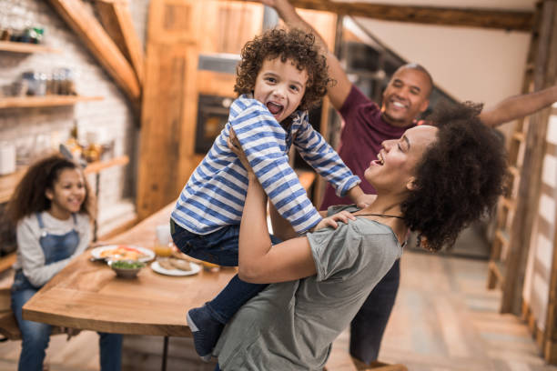 istock Playful black family having fun together in the kitchen. 960160348