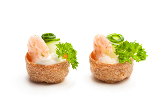 istock Salted  croustades crispy pastry stuffed with cream cheese and prawns isolated on white 960160874
